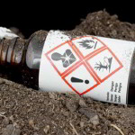 Bottle with hazardous waste thrown on the ground